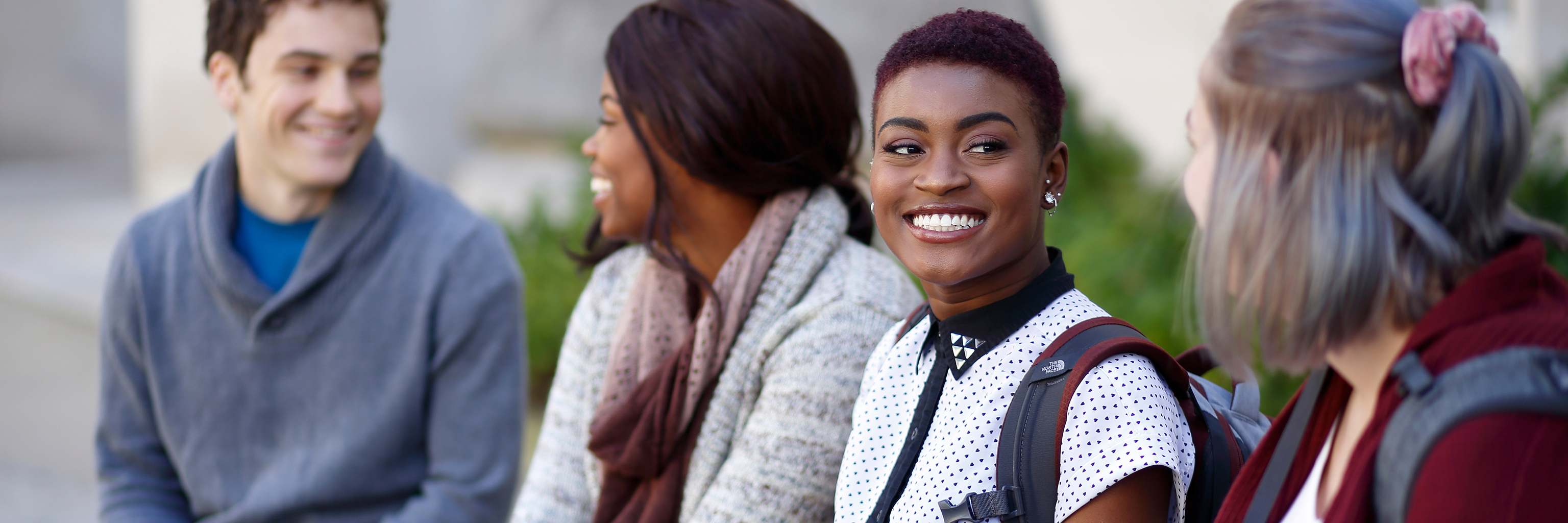 Students chat outside on the Indiana University Bloomington campus.