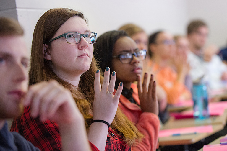 Students practice signing in class on the Indiana University Bloomington campus. 