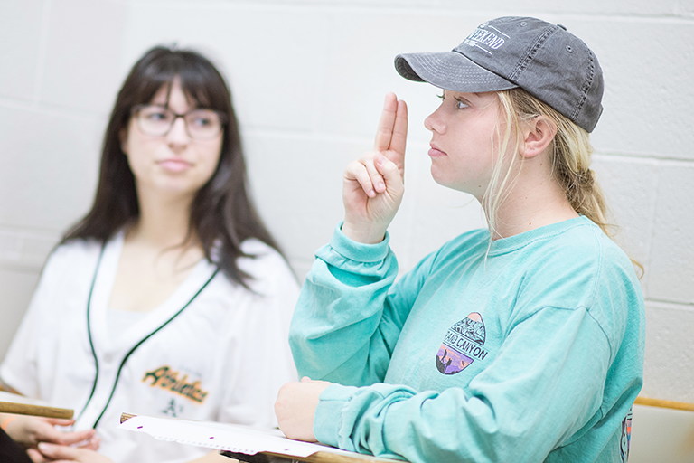 Students practice signing in class on the Indiana University Bloomington campus. 